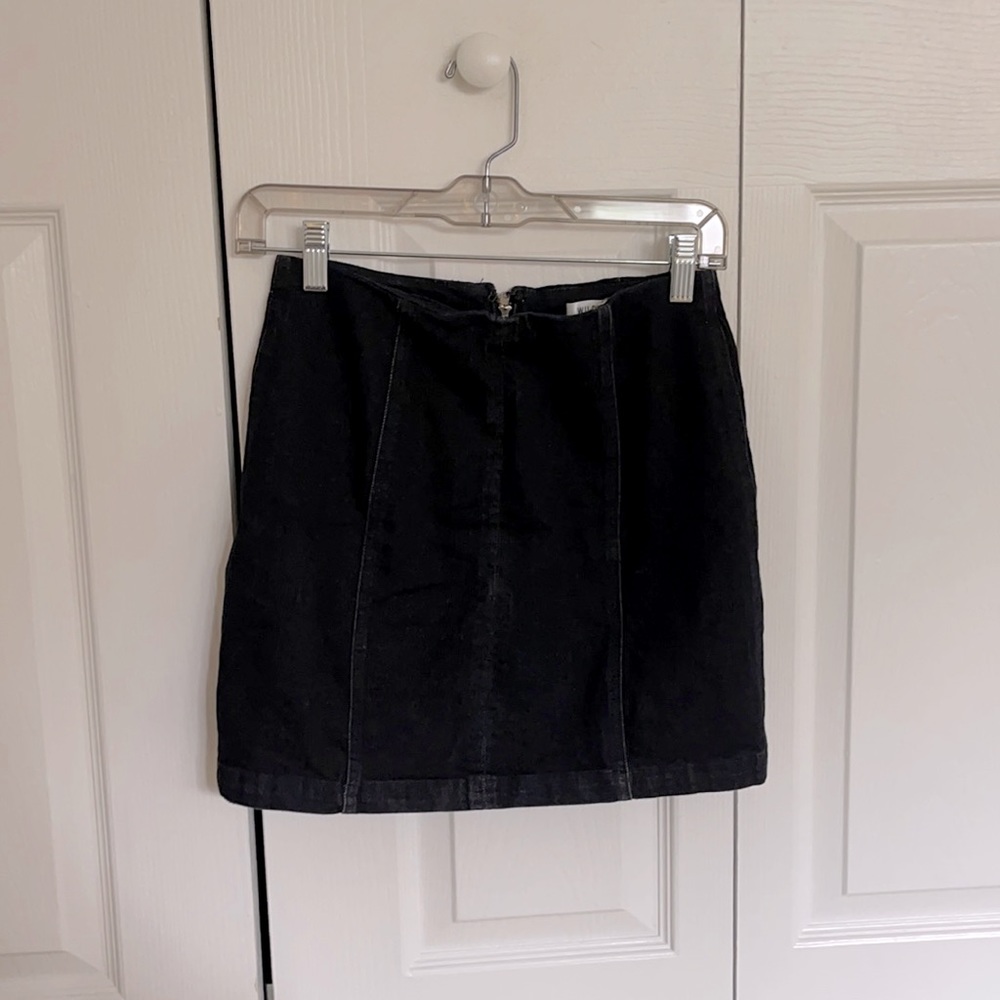 Solid black denim mini skirt with vertical seams